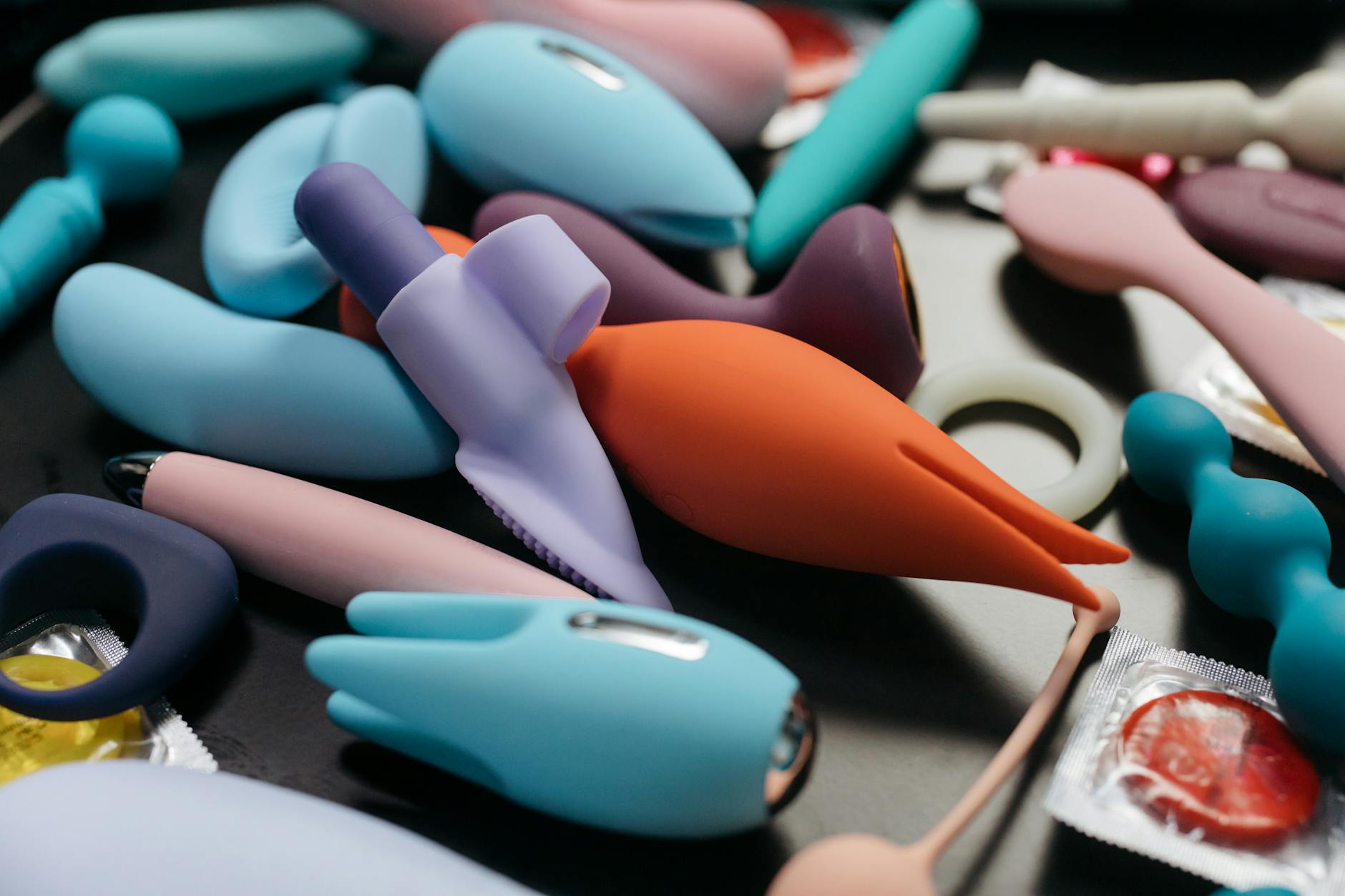 Array of vibrant adult toys and vibrators displayed in close-up view